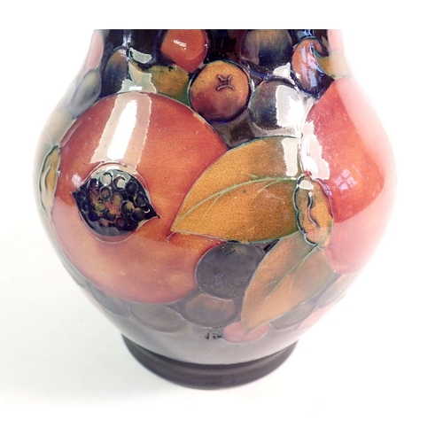 150 - A Moorcroft Pomegranate vase on blue ground, 25cm