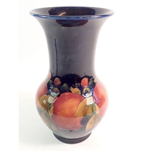 150 - A Moorcroft Pomegranate vase on blue ground, 25cm