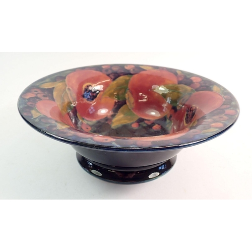 151 - A Moorcroft Pomegranate fruit dish, 23.5cm