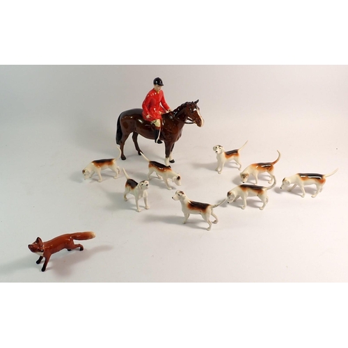 154 - A Beswick huntsman, fox and five hounds and three additional hounds - a/f