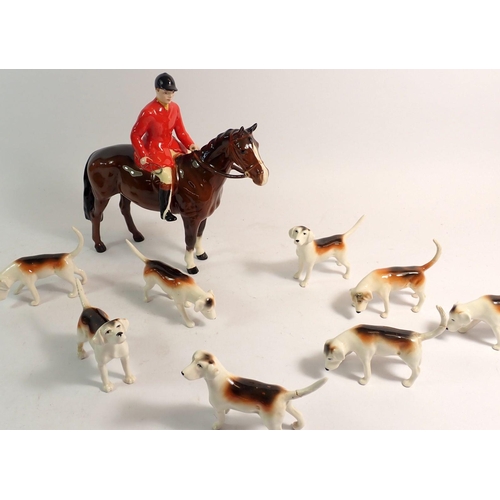 154 - A Beswick huntsman, fox and five hounds and three additional hounds - a/f