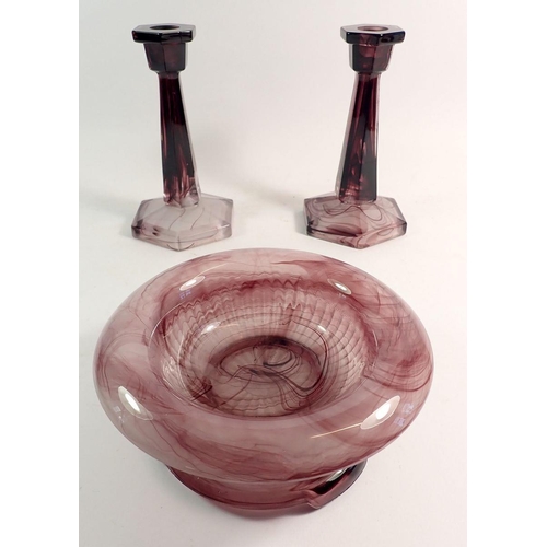 168 - A purple cloud glass bowl on stand and pair of candlesticks, 11cm tall