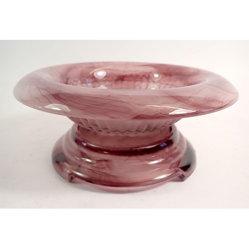 168 - A purple cloud glass bowl on stand and pair of candlesticks, 11cm tall