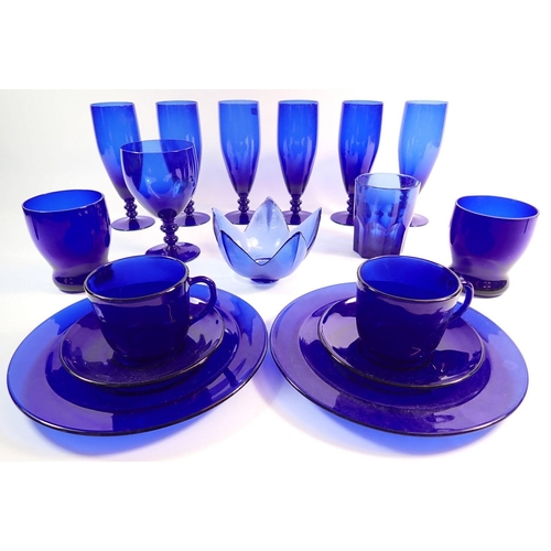 174 - A collection of Bristol blue glass comprising six wine glasses, two tumblers, two cups and saucers e... 