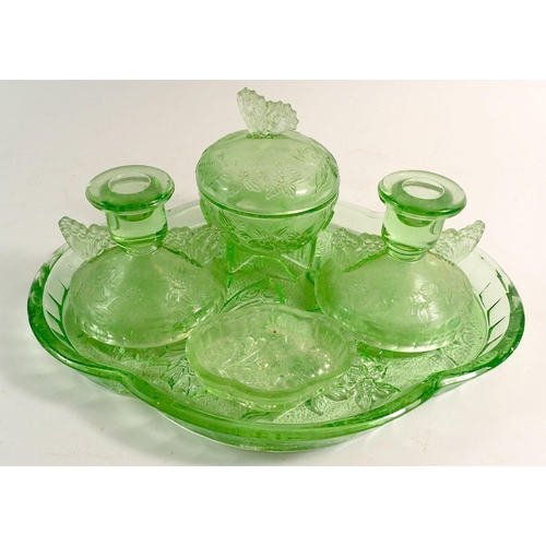 176 - An early 20th century green glass dressing table set decorated butterflies