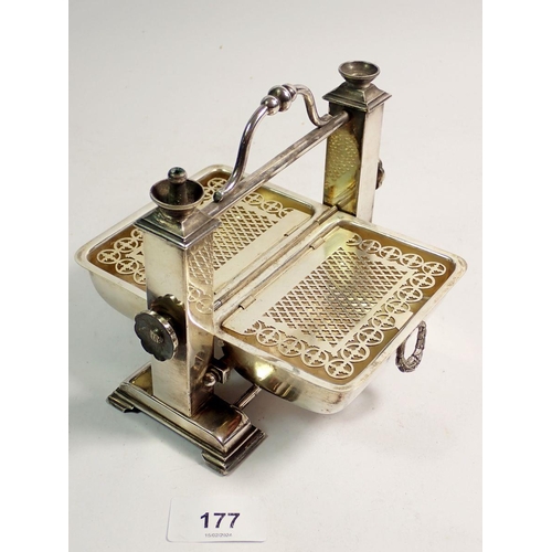 177 - A novelty Edwardian silver plated cigarette dispenser and lighter in the form of a breakfast stand, ... 