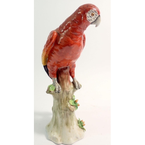 20 - A Sitzendorf porcelain parrot on tree trunk, 24cm