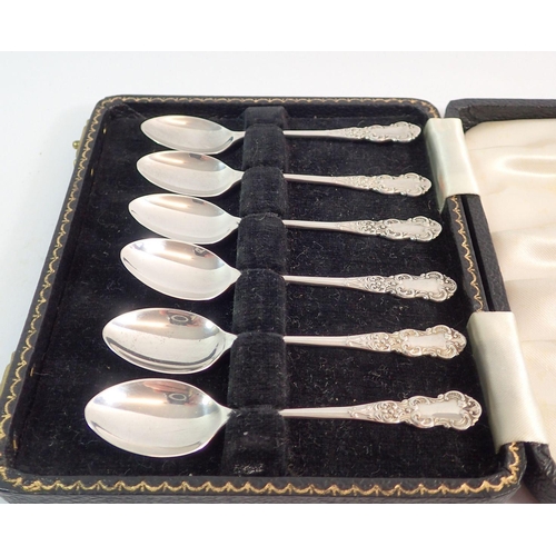 210 - A set of six silver coffee spoons, Birmingham 1956 - cased, 46g plus a silver rattle and spoon, coff... 