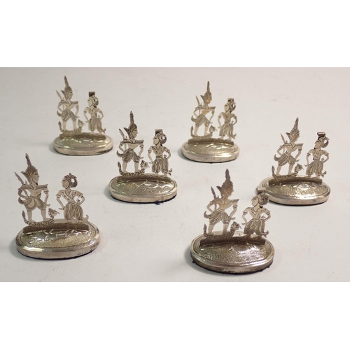 218 - A boxed set of six Malayan silver menu stands 5cm tall