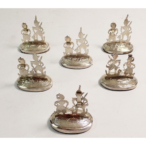 218 - A boxed set of six Malayan silver menu stands 5cm tall