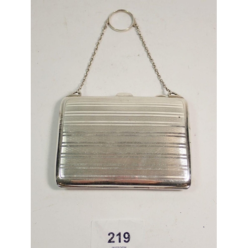 219 - A silver purse with pencil and pigskin fitted interior, Birmingham 1912, total weight 110g 10.5cm wi... 