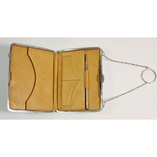 219 - A silver purse with pencil and pigskin fitted interior, Birmingham 1912, total weight 110g 10.5cm wi... 