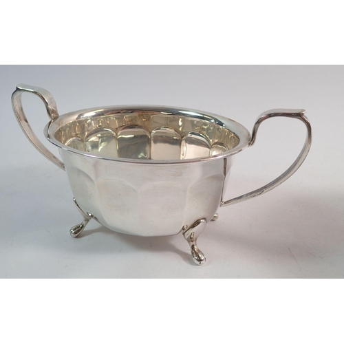 220 - A silver three piece fluted tea service, Sheffield 1939 by Viners Ltd, 955g