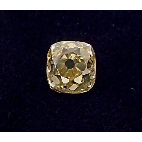 311 - An unmounted cushion cut yellow diamond, approx diamond weight 0.77ct