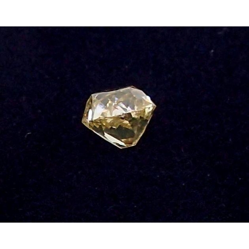 311 - An unmounted cushion cut yellow diamond, approx diamond weight 0.77ct