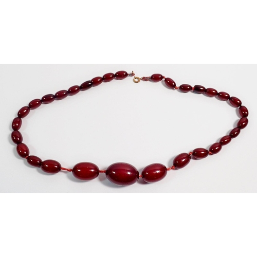 313 - A Bakelite cherry amber necklace, largest bead 2.7cm