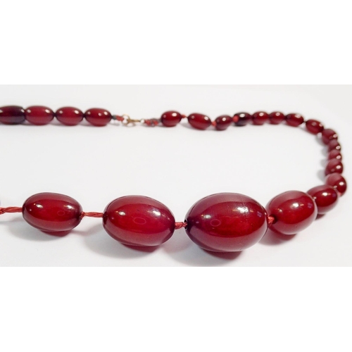 313 - A Bakelite cherry amber necklace, largest bead 2.7cm