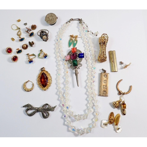 320 - A group of costume jewellery including silver ingot pendant, 30g etc.