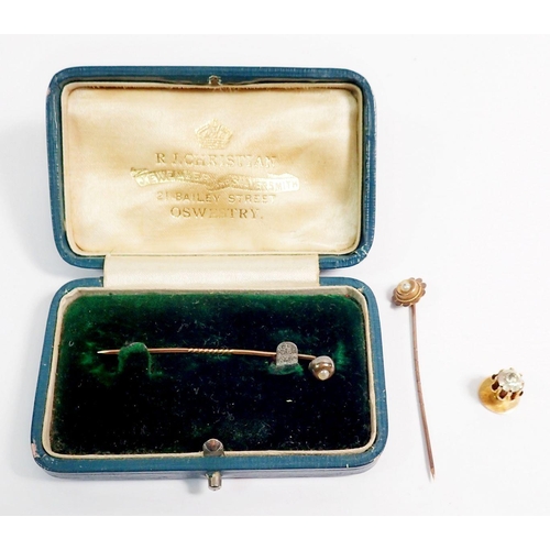 340 - A 9 carat gold stick pin set pearl and another unmarked, in fitted box plus 9 carat gold stud