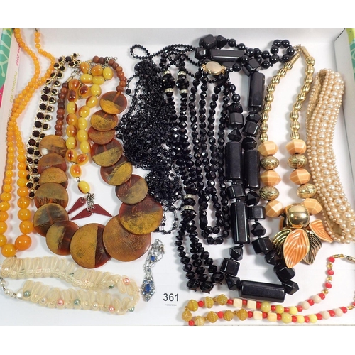 361 - A collection of jewellery to include a pressed amber necklace, prayer beads etc.