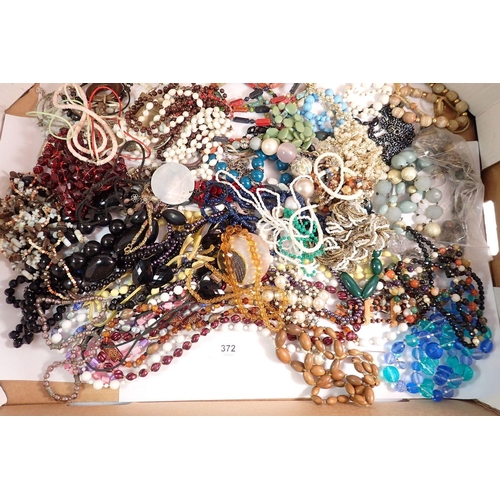 372 - A box of costume beaded necklaces etc.