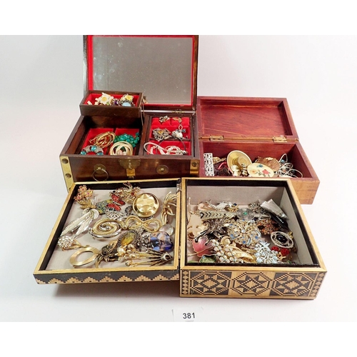 381 - Three wooden boxes of various costume jewellery including brooches, necklaces etc.