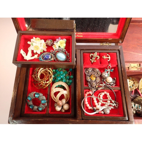 381 - Three wooden boxes of various costume jewellery including brooches, necklaces etc.