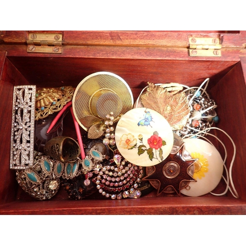 381 - Three wooden boxes of various costume jewellery including brooches, necklaces etc.