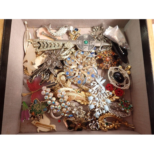 381 - Three wooden boxes of various costume jewellery including brooches, necklaces etc.