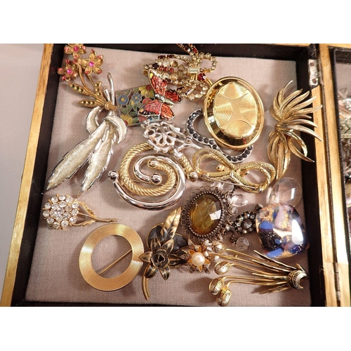 381 - Three wooden boxes of various costume jewellery including brooches, necklaces etc.