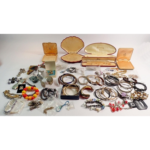 386 - A box of costume bracelets and vintage jewellery boxes etc.