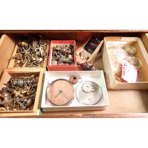 391 - A collectors oak cabinet of six drawers including various watch faces, watch and clock accessories a... 