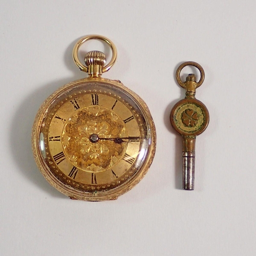 394 - An 18 carat gold fob watch with engraved decoration