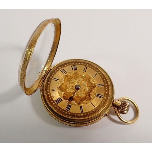 394 - An 18 carat gold fob watch with engraved decoration