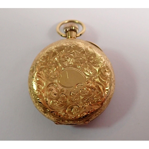 394 - An 18 carat gold fob watch with engraved decoration