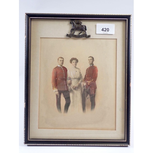 420 - A military tinted photograph of two officers of the Queens Regiment circa 1900 with their mother fra... 