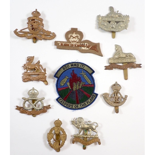 421 - A small group of cap badges