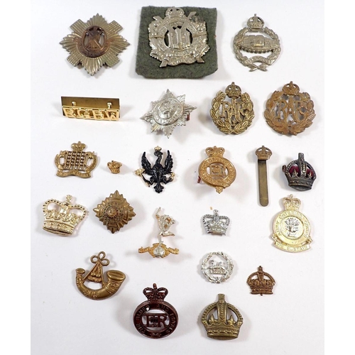 426 - A box of cap badges