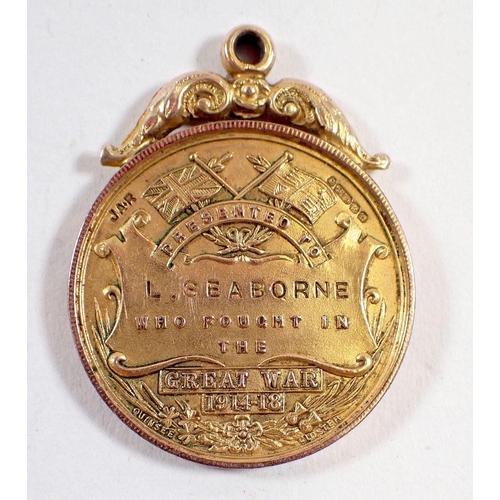 444 - A WWI 9 carat gold Lydney Welcome Home medallion of Forest of Dean interest, presented to L Seabourn... 