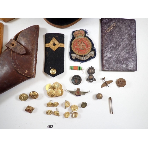 462 - A box of military items including Irish Guards cap and badge, leather pistol holder, copper spitfire... 