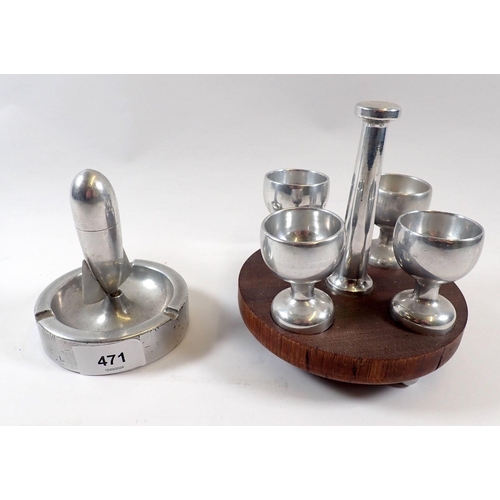 471 - A aluminium German prisoner of war eggcup stand and Zeppelin ashtray