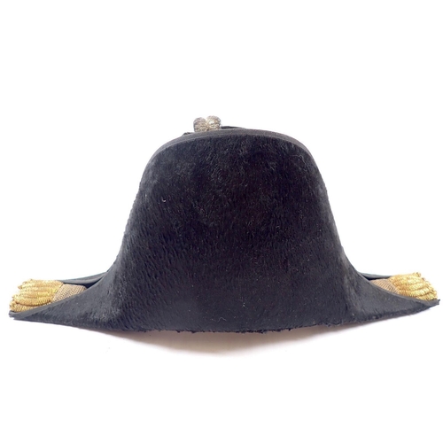 497 - A naval bicorn hat with gilt and silver braiding, silk lined interior, with tin box stamped J W Caru... 