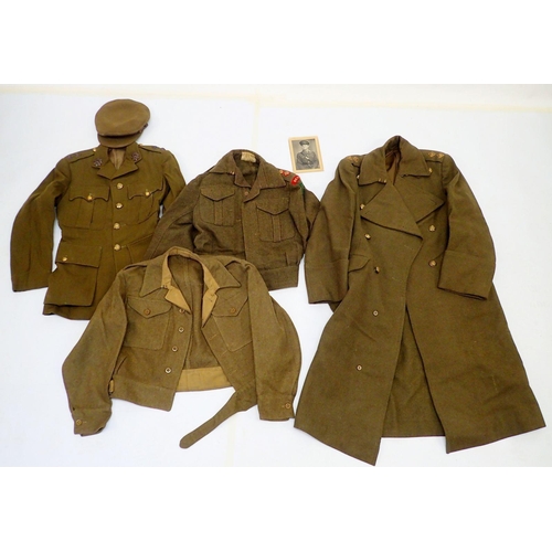 502A - A WWII uniform for Devonshire Regiment including two battle dress jackests, cap, Great Coat and para... 