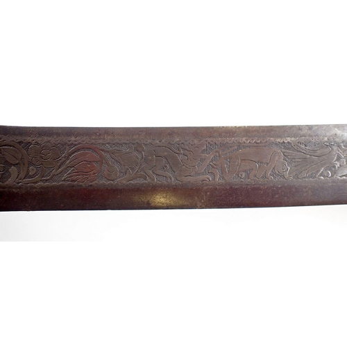 507 - An antique Burmese sword or dha, the singe edge curved blade decorated animals, flowers and foliage ... 