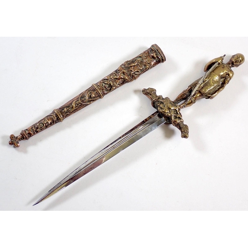 509 - An unusual decorative brass dagger on theme of The Last of the Mohicans with Mohican warrior figure ... 