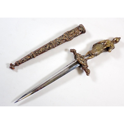 509 - An unusual decorative brass dagger on theme of The Last of the Mohicans with Mohican warrior figure ... 