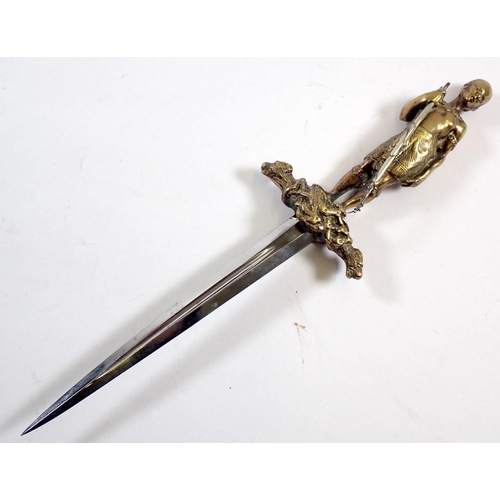 509 - An unusual decorative brass dagger on theme of The Last of the Mohicans with Mohican warrior figure ... 