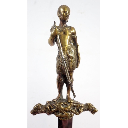 509 - An unusual decorative brass dagger on theme of The Last of the Mohicans with Mohican warrior figure ... 