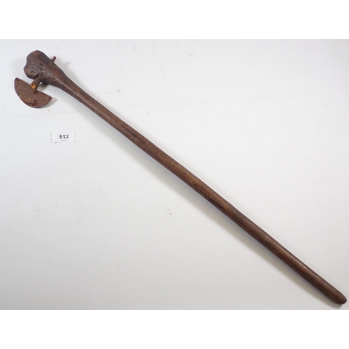 512 - An antique tribal fighting axe with wooden handle and metal head, 67cm