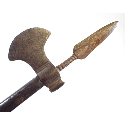 513 - A 19th century mahogany handled fighting axe with metal blade and spear top, 70cm